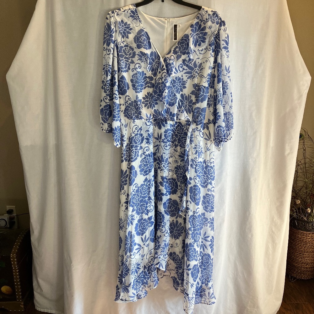 Chiffon faux wrap style blue floral dress with ruffled hi-low hem and neck